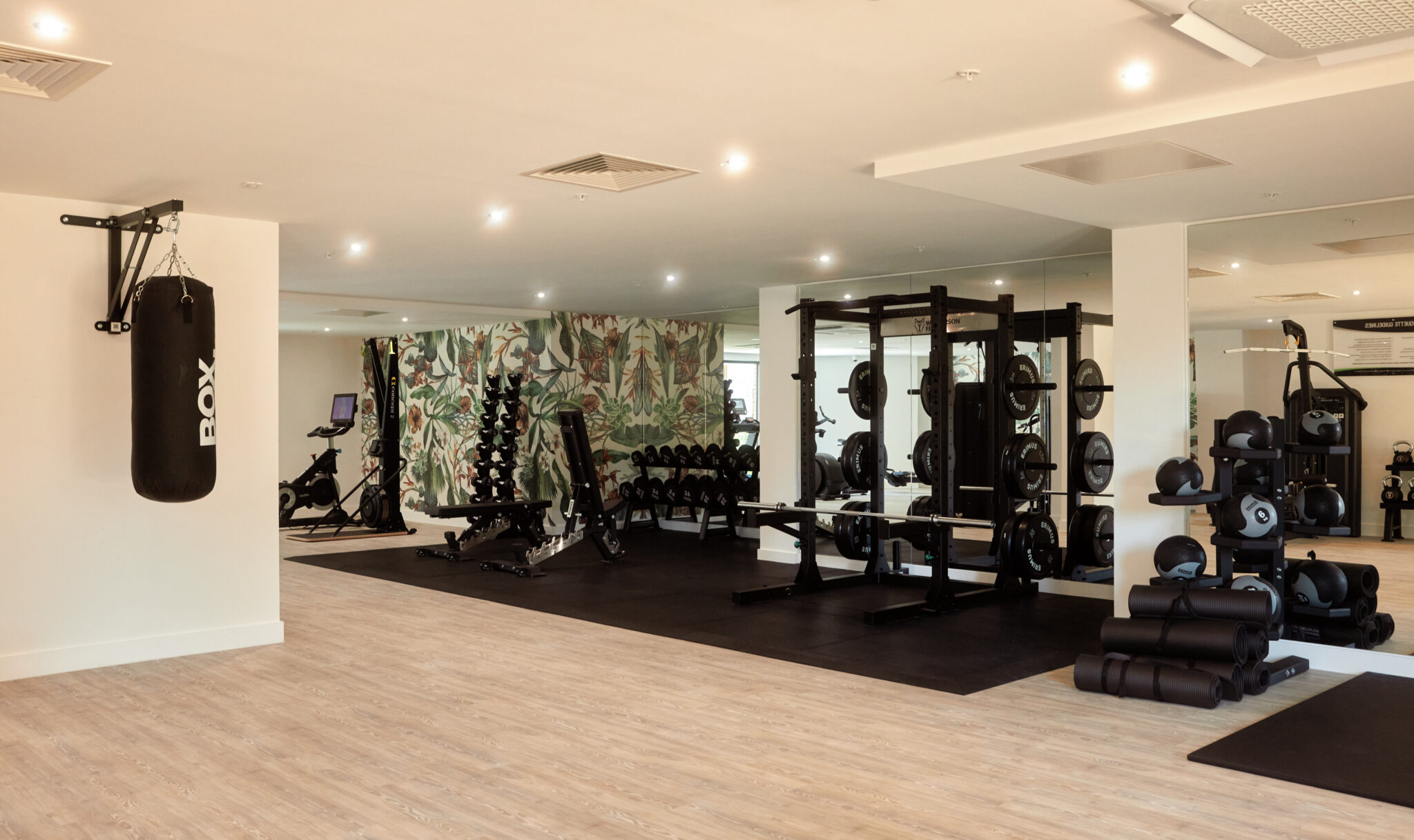 Room with gym equipment and floral wallpaper