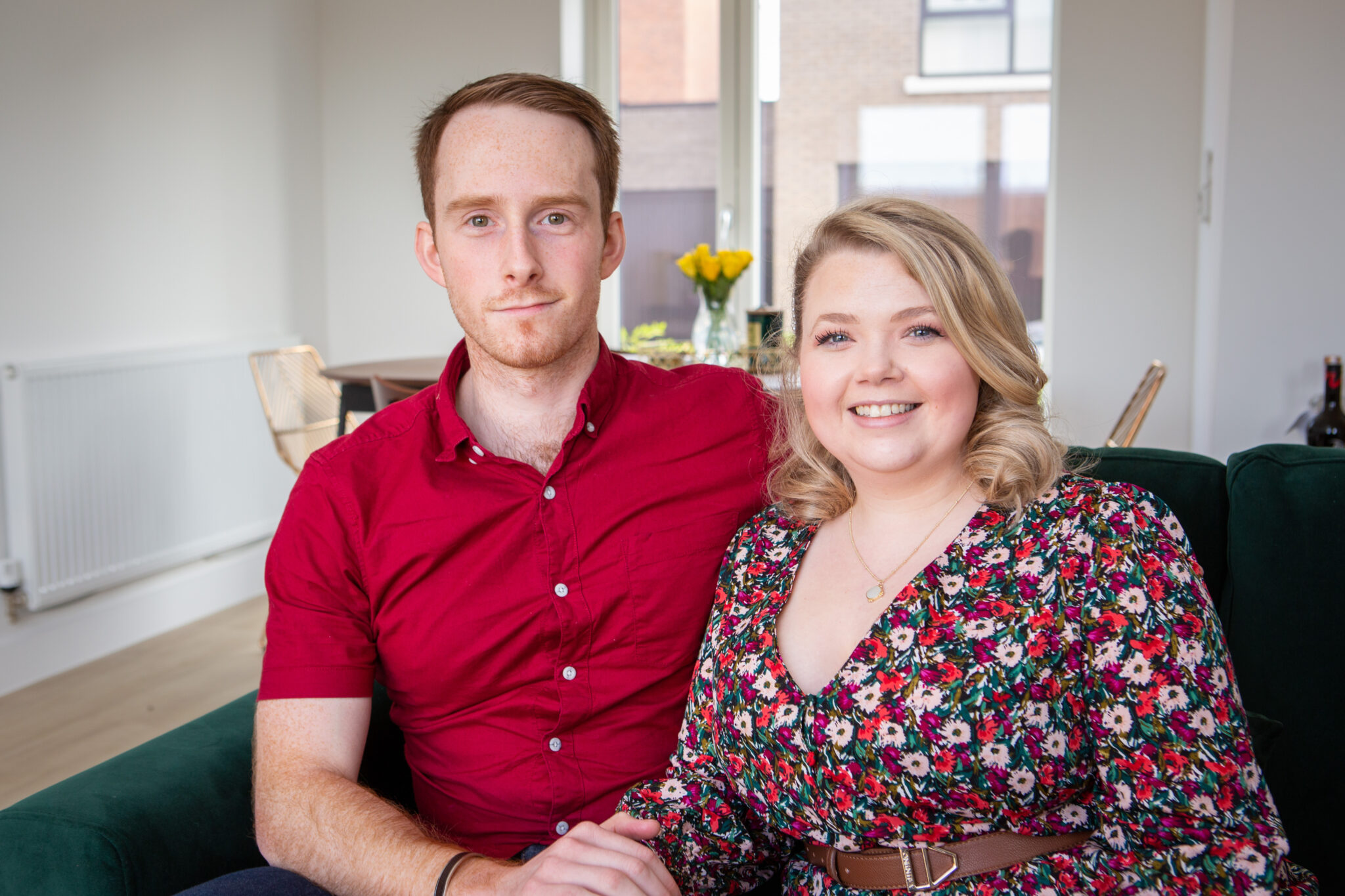 A couple sitting on the sofa