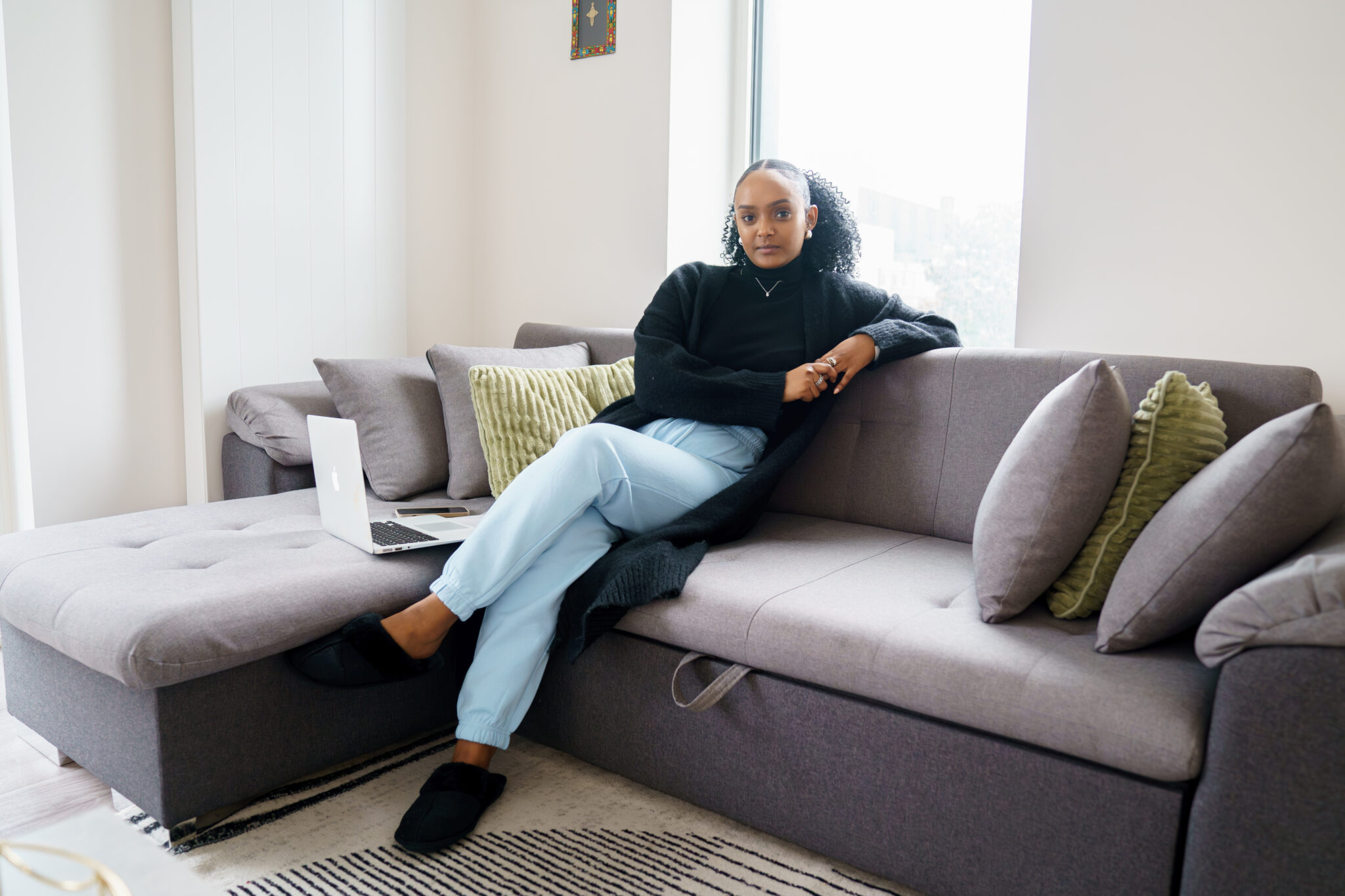 Merone sitting on a sofa